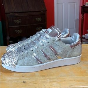A pair of Silver Metallic adidas